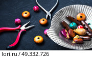 Bright wooden beads. Variety of wooden beads for needlework in a stylish tray. Стоковое фото, агентство Ingram Publishing / Фотобанк Лори