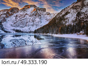 winter sunrise over Lago di Braies, Dolomites, Italy. winter sunrise with colorful cloudscape over Lago di Braies, Dolomites, Italy. Стоковое фото, агентство Ingram Publishing / Фотобанк Лори