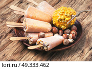 unusual ice cream with pumpkin. extraordinary ice cream with pumpkin taste and hazelnut. Стоковое фото, агентство Ingram Publishing / Фотобанк Лори