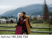 pair of lovers in the Carpathian mountains in national costumes. Стоковое фото, агентство Ingram Publishing / Фотобанк Лори