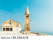 Church of Our Lady of the Angel on the beach of Caorle Italy, Santuario della Madonna dell’Angelo. Стоковое фото, агентство Ingram Publishing / Фотобанк Лори