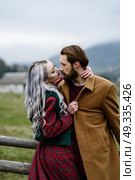 pair of lovers in the Carpathian mountains in national costumes. Стоковое фото, агентство Ingram Publishing / Фотобанк Лори