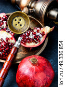 hookah with pomegranate. Exotic smoking shisha in east style with tobacco aroma of pomegranate.Fruit hookah. Стоковое фото, агентство Ingram Publishing / Фотобанк Лори
