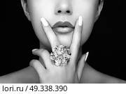 Beauty Fashion woman Lips with natural Makeup and white Nail Polish. Gloss Lipstick. Beauty girl Face close up. Sexy Lips, Manicure, Make up. Ring with Precious Stones, Jewelry. Стоковое фото, агентство Ingram Publishing / Фотобанк Лори