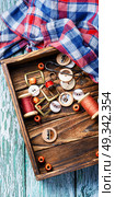 Tools for needlework. sewing kit from sewing thread, buttons and fabric. Стоковое фото, агентство Ingram Publishing / Фотобанк Лори