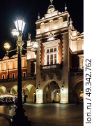 Night old commercial area of Krakow in the lights of street lamps. Old Europe. Стоковое фото, агентство Ingram Publishing / Фотобанк Лори