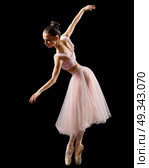 Young ballerina (isolated on black version) Стоковое фото, агентство Ingram Publishing / Фотобанк Лори