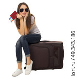 Young travelling girl isolated on white. Стоковое фото, агентство Ingram Publishing / Фотобанк Лори