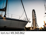 Ferris wheel against the blue sky in the port city Gdynia Poland. Стоковое фото, агентство Ingram Publishing / Фотобанк Лори