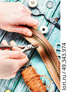 Tools for leather craft. Tailor working with leather goods in retro style. Стоковое фото, агентство Ingram Publishing / Фотобанк Лори