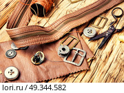 Tools for leather craft. Working tools and cut out pieces of leather. Стоковое фото, агентство Ingram Publishing / Фотобанк Лори