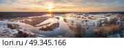 Spring melting river flood panorama. Sunset over thaw meadows. Streaming water at early springtime. Drone view. Стоковое фото, агентство Ingram Publishing / Фотобанк Лори