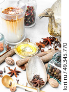 Masala tea with spices. Glass cup of traditional indian masala tea.Masala chai. Стоковое фото, агентство Ingram Publishing / Фотобанк Лори