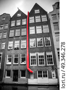 Amsterdam. black and white photo with elements of red. Стоковое фото, агентство Ingram Publishing / Фотобанк Лори
