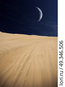 Tourists travel through the dunes in the Atacama Desert. Oasis of Huacachina, Peru, South America. moon shines. Стоковое фото, агентство Ingram Publishing / Фотобанк Лори