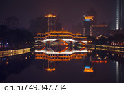 Anshun Bridge and the new development in Chengdu in southwest China. Anshun Bridge. Стоковое фото, агентство Ingram Publishing / Фотобанк Лори