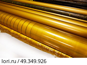 Printer ink machine rotary printing. Printer ink machine rotary printing factory golden printer rollers. Стоковое фото, агентство Ingram Publishing / Фотобанк Лори