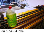 Printer ink machine rotary printing. Printer ink machine rotary printing factory cleaning bottle. Стоковое фото, агентство Ingram Publishing / Фотобанк Лори