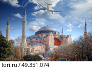 the plane is flying over Hagia Sophia (Ayasofya) Istanbul, Turkey. Hagia Sophia. Стоковое фото, агентство Ingram Publishing / Фотобанк Лори