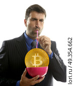 Bitcoin BTC liquidity concept businessman drinking. Bitcoin BTC liquidity concept businessman drinking with straw. Стоковое фото, агентство Ingram Publishing / Фотобанк Лори