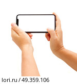 WARSAW, POLAND - DECEMBER 02, 2017: Someones hands holding new Iphone X mobile phone over white background. New Iphone X. New Iphone X. Редакционное фото, агентство Ingram Publishing / Фотобанк Лори
