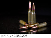 Ammunition cartridges on black background. Ammunition cartridges on black. Стоковое фото, агентство Ingram Publishing / Фотобанк Лори