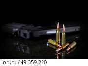 Ammunition cartridges on black background. Ammunition cartridges on black. Стоковое фото, агентство Ingram Publishing / Фотобанк Лори