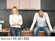 The image of quarrel of a married couple on kitchen. Quarrel. Стоковое фото, агентство Ingram Publishing / Фотобанк Лори