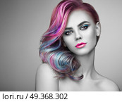 Beauty fashion model girl with colorful dyed hair. Beauty Fashion Model Girl with Colorful Dyed Hair. Girl with perfect Makeup and Hairstyle. Model with perfect Healthy Dyed Hair. Rainbow Hairstyles. Стоковое фото, агентство Ingram Publishing / Фотобанк Лори