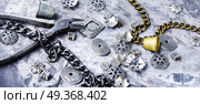 Jewelry and bijouterie. Stylish female jewelry made of chains, beads and pendants.Design and bijouterie. Стоковое фото, агентство Ingram Publishing / Фотобанк Лори