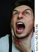 Stressed and  kicked man . Стоковое фото, агентство Ingram Publishing / Фотобанк Лори