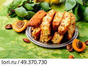 Variety of biscotti - cantucci, cantuccini, kind of biscuit, with the addition of almonds and dried fruits. Italian almond biscotti. Стоковое фото, агентство Ingram Publishing / Фотобанк Лори
