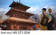 a couple of tourists travel around the city of Kathmandu. Nepal. Стоковое фото, агентство Ingram Publishing / Фотобанк Лори