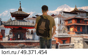 A male tourist is traveling around the city of Kathmandu. Nepal. Стоковое фото, агентство Ingram Publishing / Фотобанк Лори
