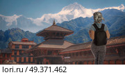 girl tourist travels with a backpack around the city of Kathmandu. Nepal. Стоковое фото, агентство Ingram Publishing / Фотобанк Лори