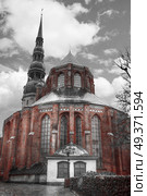 Riga Church of St. Peter and the streets of the ancient city. black and red and white photo. Стоковое фото, агентство Ingram Publishing / Фотобанк Лори