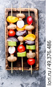 Grilled vegetable kebabs on skewers with tomato, pepper, mushrooms,zucchini and onion.Vegan diet.Vegetables kebab. Vegetables grilled skewers. Стоковое фото, агентство Ingram Publishing / Фотобанк Лори