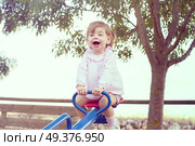 Little girl playing at the park . Стоковое фото, агентство Ingram Publishing / Фотобанк Лори