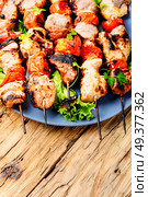 Grilled shish kebab or shashlik on skewers.Fast food.BBQ. Grilled meat skewers, shish kebab. Стоковое фото, агентство Ingram Publishing / Фотобанк Лори