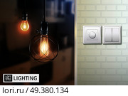 Poster with lamps in loft style on blurred background and switches on white brick wall vector illustration . Loft Style Lamps And Switches Poster. Стоковая иллюстрация, агентство Ingram Publishing / Фотобанк Лори