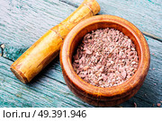 Grinded rhizomes of plant iris in mortar.Herbal medicine.Herbalism. Grinded rhizomes of iris. Стоковое фото, агентство Ingram Publishing / Фотобанк Лори