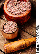 Grinded rhizomes of plant iris in mortar.Herbal medicine.Herbalism. Grinded rhizomes of iris. Стоковое фото, агентство Ingram Publishing / Фотобанк Лори