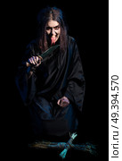 Scary witch isolated with voodoo doll version. Стоковое фото, агентство Ingram Publishing / Фотобанк Лори