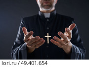 Priest open hands arms praying offering oblation. Стоковое фото, агентство Ingram Publishing / Фотобанк Лори