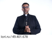 Priest pastor portrait praying hands relaxed. Стоковое фото, агентство Ingram Publishing / Фотобанк Лори