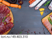 spanish tapas with salami, chorizo, lomo, jamon, picnic table, top view frame with copy space. Picnic table with spanish sausage tapas. Стоковое фото, агентство Ingram Publishing / Фотобанк Лори