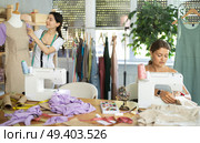 Dressmakers work in the workshop and sew clothes. Стоковое фото, фотограф Яков Филимонов / Фотобанк Лори