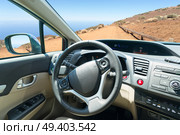car windscreen with mountain ountry road, view inside out. car windscreen with road. Стоковое фото, агентство Ingram Publishing / Фотобанк Лори