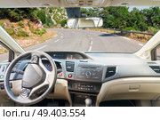 car windscreen with country road, view inside out. car windscreen with road. Стоковое фото, агентство Ingram Publishing / Фотобанк Лори