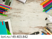 back to school frame with school supplies on aged wooden table. back to school frame. Стоковое фото, агентство Ingram Publishing / Фотобанк Лори